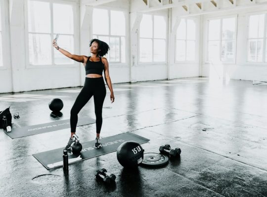 a woman is doing exercises in a gym