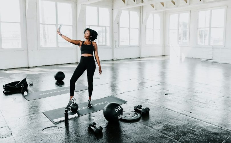 a woman is doing exercises in a gym