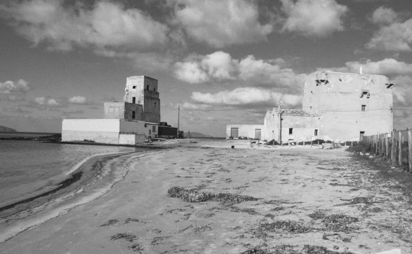 Black and white image of historic buildings on the Trapani coast, Sicily.